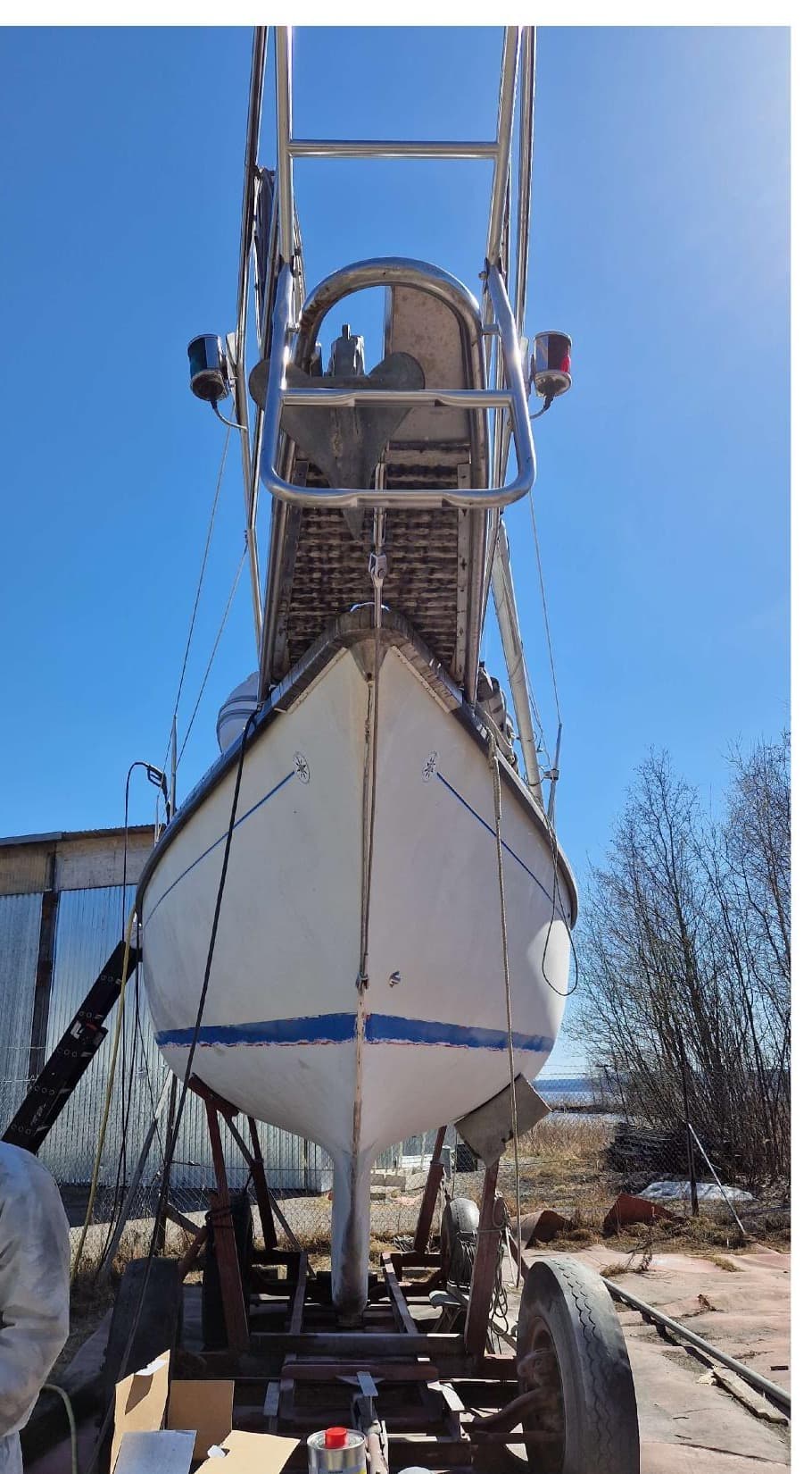 S/Y Gabriel hauled on a cradle in Fagervik, hull stripped to gelcoat for refit